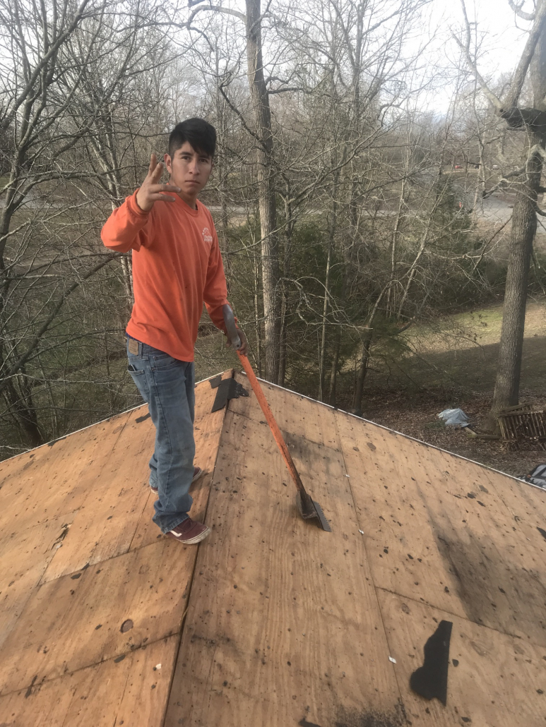 Hendersonville roofer working on a roof replacement