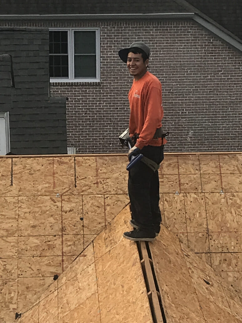 Smiling roofer from Five Points Roofing company working on a Smyrna, TN roof