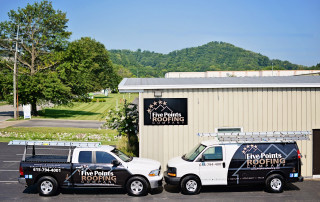 Five Points Roofing Company office building and work trucks