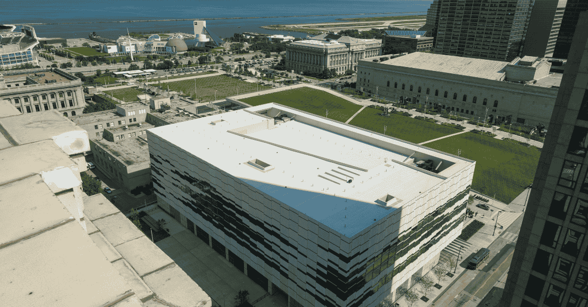 A large flat roof on a commercial building with efficient drainage and rooftop utilities.