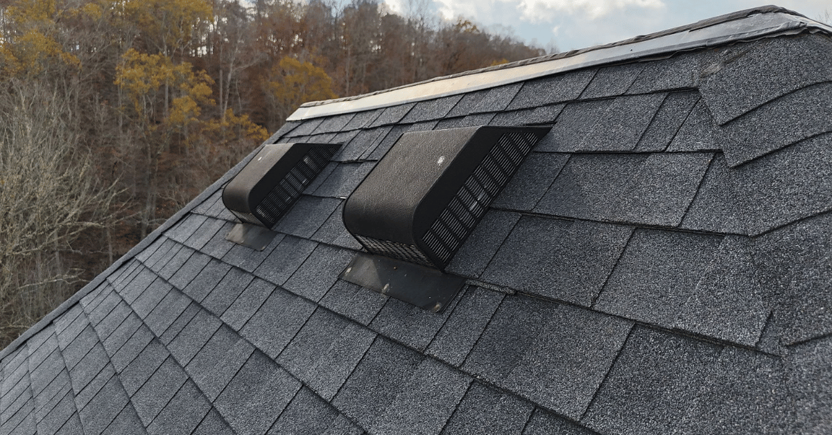 Close-up of roof vents installed on an asphalt shingle roof.
