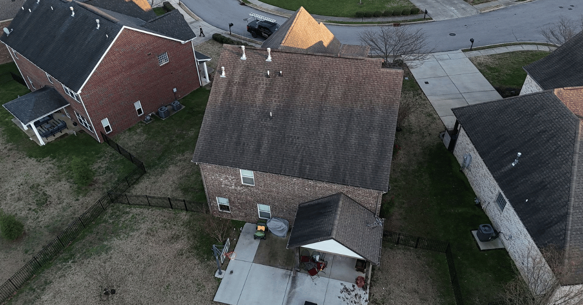 Drone view of a home with Tamko shingles showing visible streaking and wear.