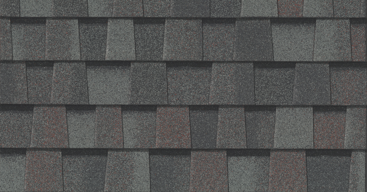 A close-up of architectural asphalt shingles with a multi-dimensional design.