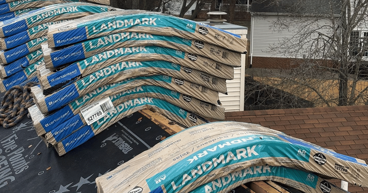 Bundles of CertainTeed Landmark shingles stacked on a roof, ready for installation.