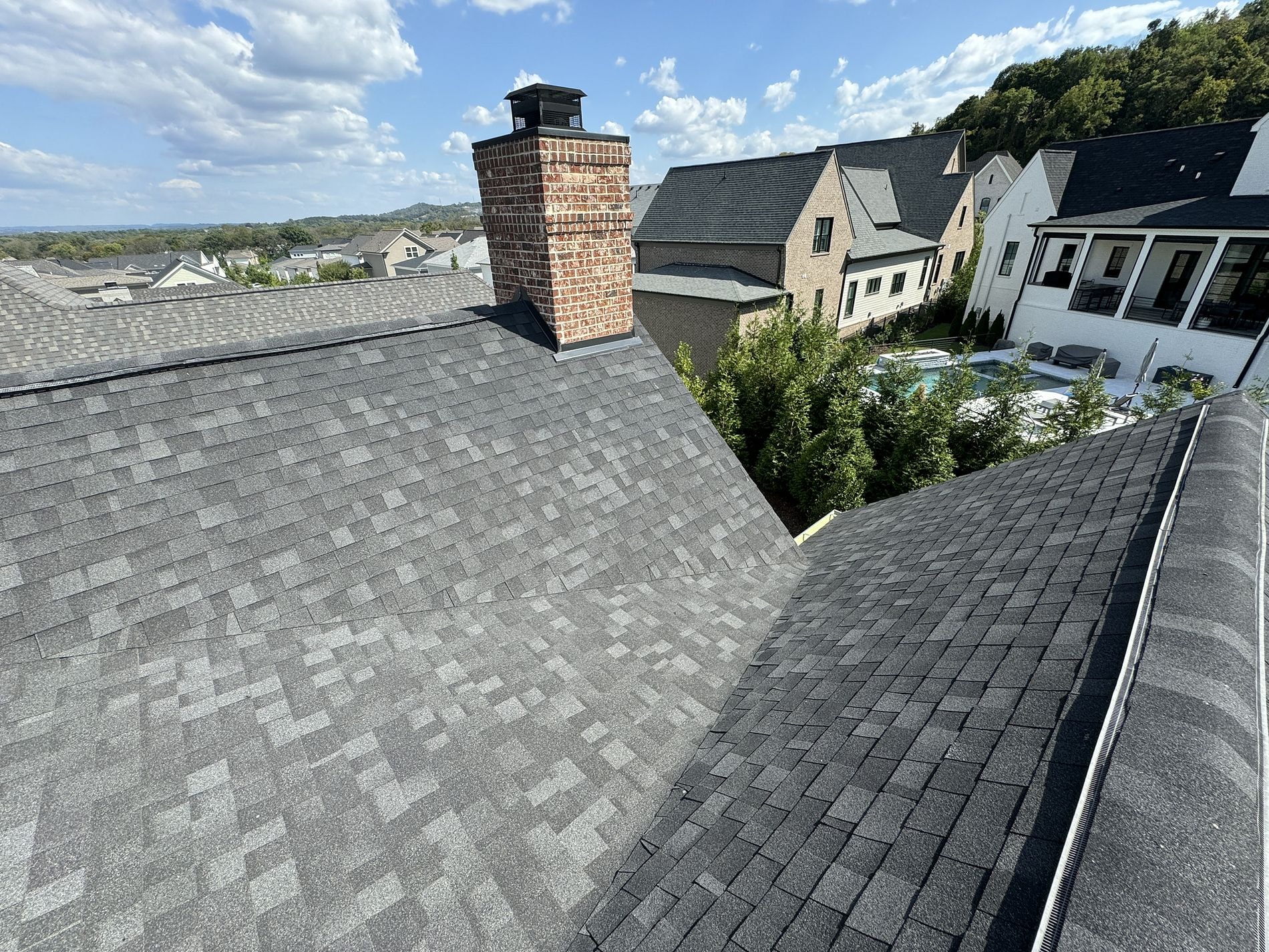 Rooftop view showing clean ridge lines and well-laid shingles