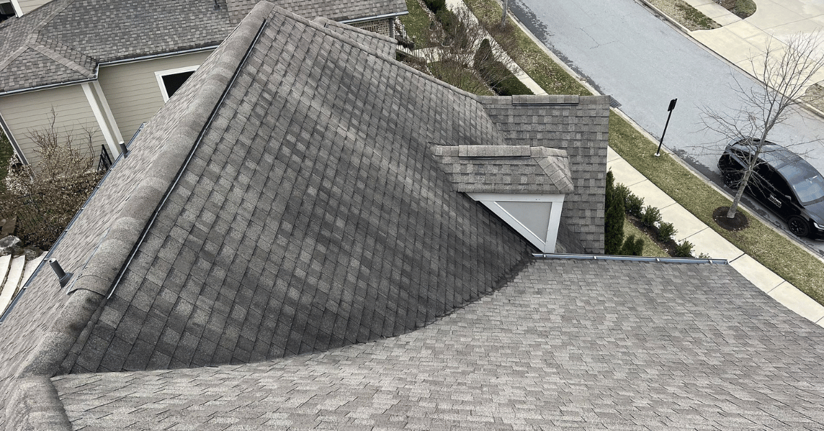 A sloped roof covered in TAMKO shingles displaying a clean and uniform pattern.