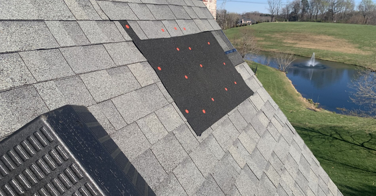 A section of a roof with newly installed underlayment and fasteners.