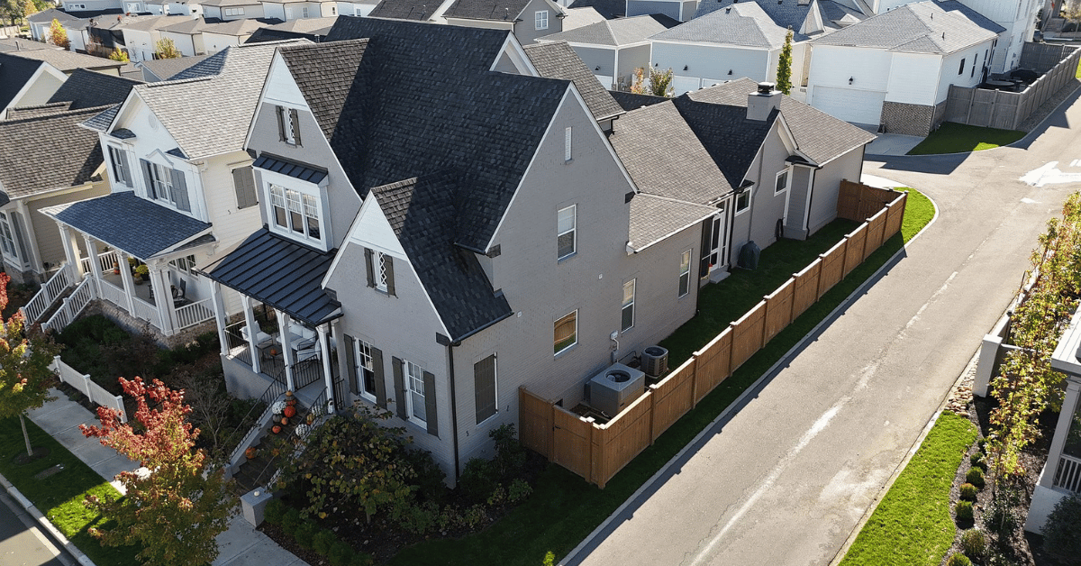 Neighborhood in Franklin, TN with multiple homes showing asphalt shingle roofing systems in good condition, inspected for storm damage or warranty issues.
