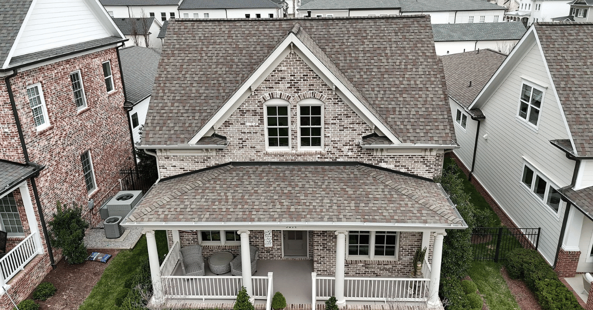 Aerial view of a newly replaced architectural shingle roof in Franklin, Tennessee, showcasing expert installation and curb appeal.