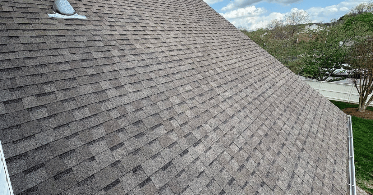 A clean new roof with architectural shingles after a full tear off and roof replacement in Franklin, Tennessee, installed by Five Points Roofing.