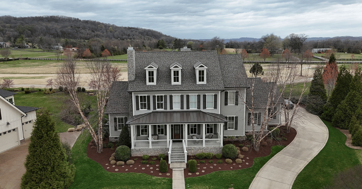 A freshly installed architectural shingle roof on a luxury home in Franklin, Tennessee, showcasing improved curb appeal and craftsmanship.