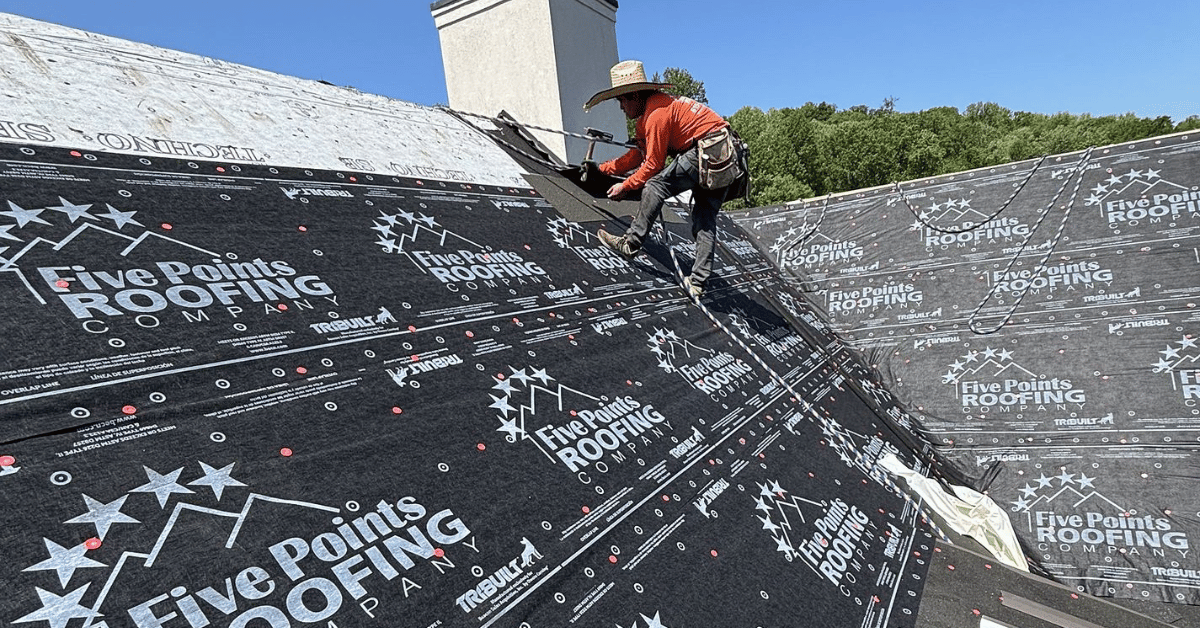 Five Points Roofing team installing premium underlayment during a full roof replacement to prevent moisture damage and increase longevity.