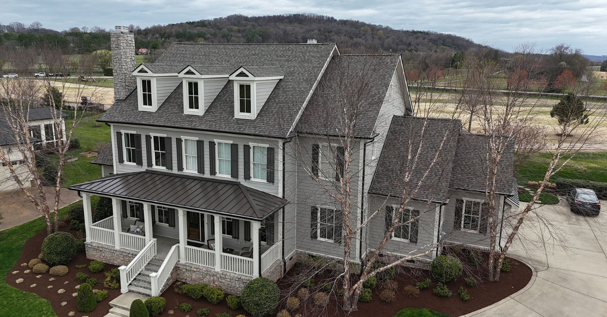 A side view of a home in Middle Tennessee with a brand new roof installed by Five Points Roofing, increasing resale value and visual appeal.