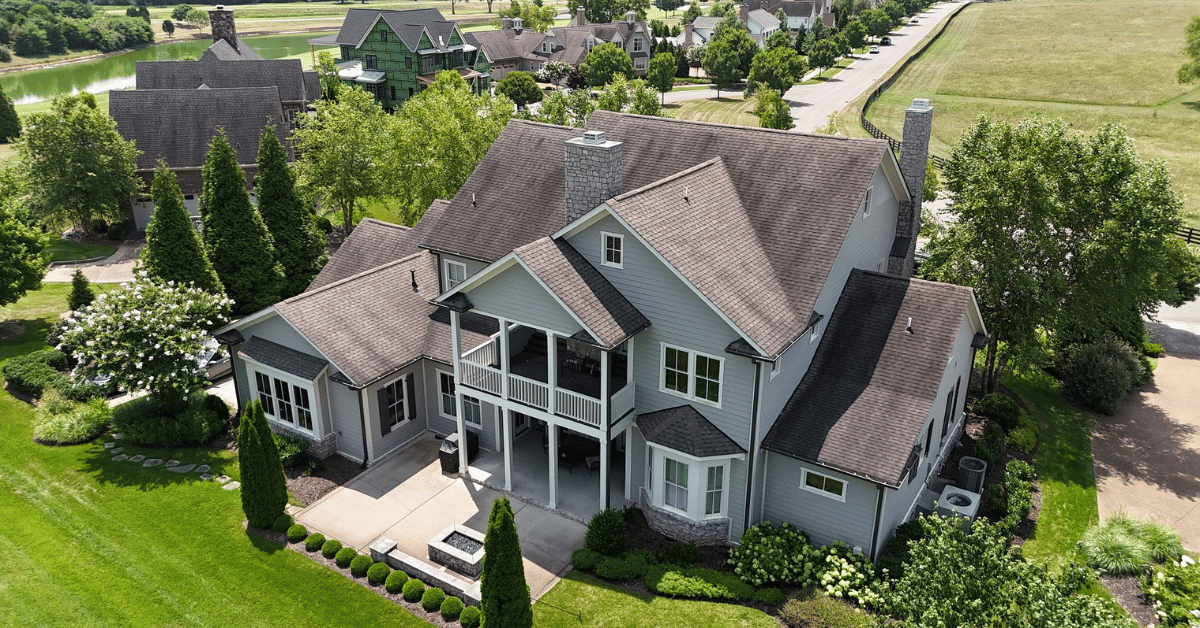 Backside of a beautifully updated home in Franklin TN, featuring a full shingle roof replacement to boost property value and buyer appeal.