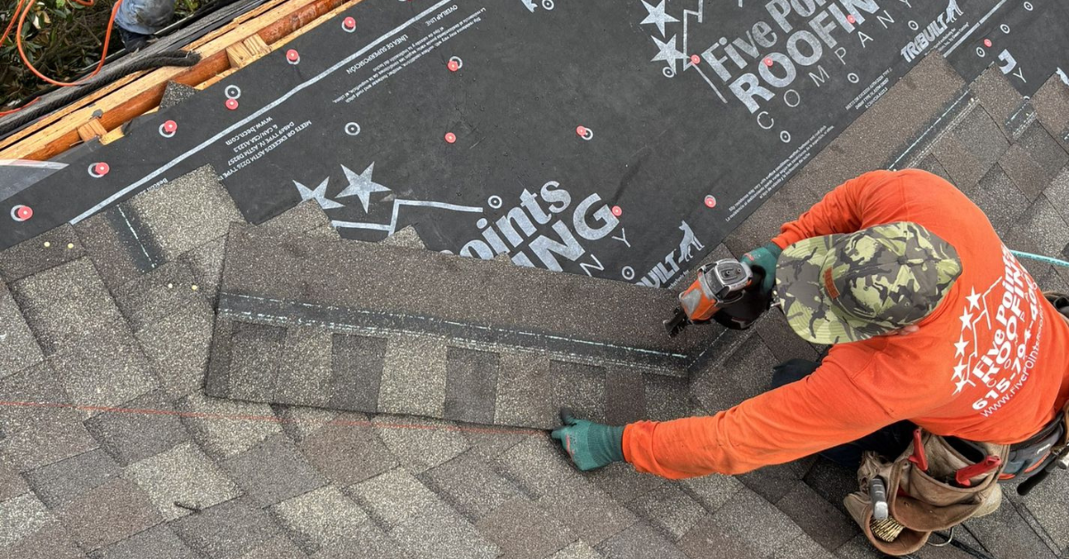 Five Points Roofing crew installing new shingles with synthetic underlayment after storm damage in Franklin TN