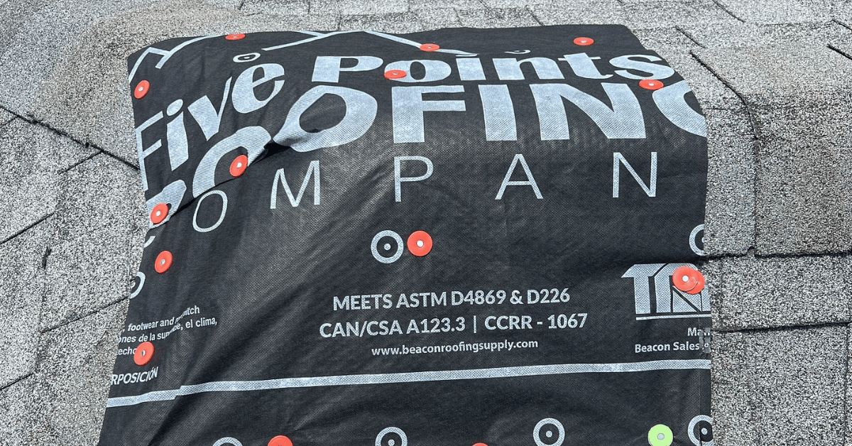 Branded underlayment from Five Points Roofing installed under shingles during roof replacement, demonstrating quality and coverage.