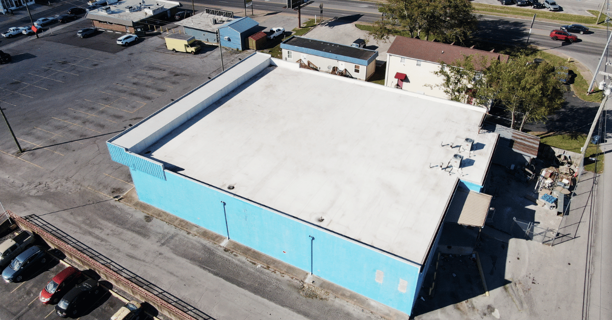 Aerial View of Restored Flat Roof Overhead view of the fully restored flat roof on the Lebanon Thrift Building, showcasing the clean TPO finish.