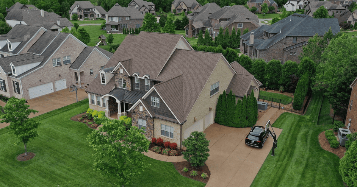 Aerial view of the completed roof replacement using CertainTeed Landmark shingles in Heather Blend on a Brentwood, TN home.