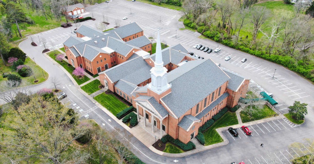Front View of Finished Church Roofing Project Aerial shot highlighting the front steeple and completed roofing system at Hillsboro Church of Christ.