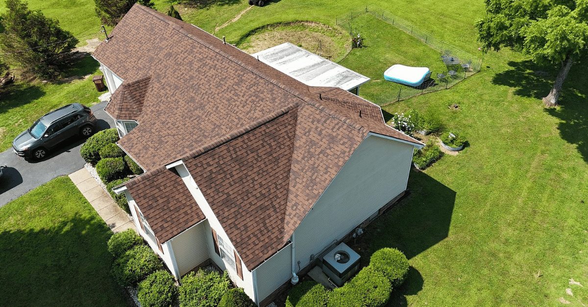 Aerial view of a newly installed architectural asphalt shingle roof on a suburban home in Franklin, TN.