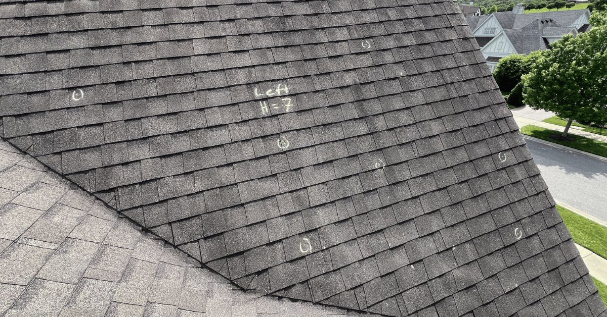 Hail Damage Documentation – Left Roof Slope Aerial photo of the left slope with hail strikes marked, used for insurance documentation and assessment.