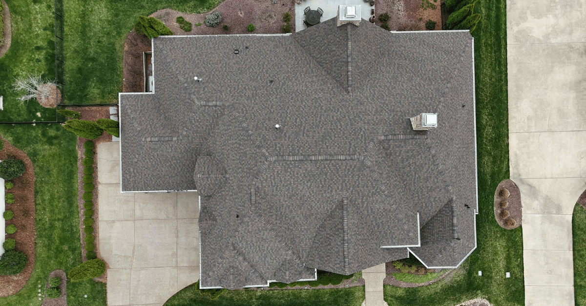Aerial side angle of completed roof replacement with new architectural shingles in College Grove, TN.