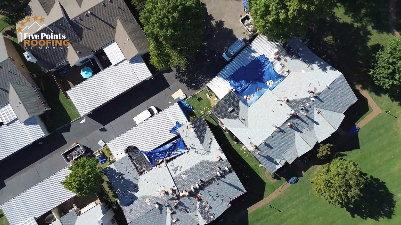 Mid-Installation Progress of Roof Replacement – Villages of Morningside, Franklin, TN Bird’s eye view of active roofing crews working on multiple buildings during the Five Points Roofing full community replacement project in Franklin.