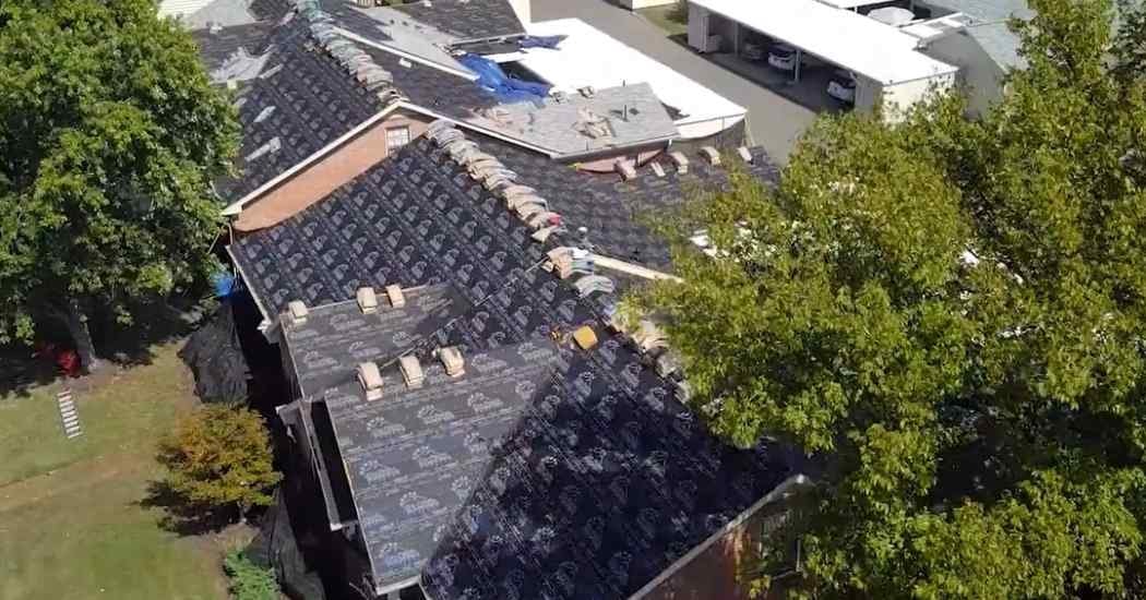 Five Points Roofing installing branded underlayment on a large residential roofing project in Franklin, TN before shingle application.